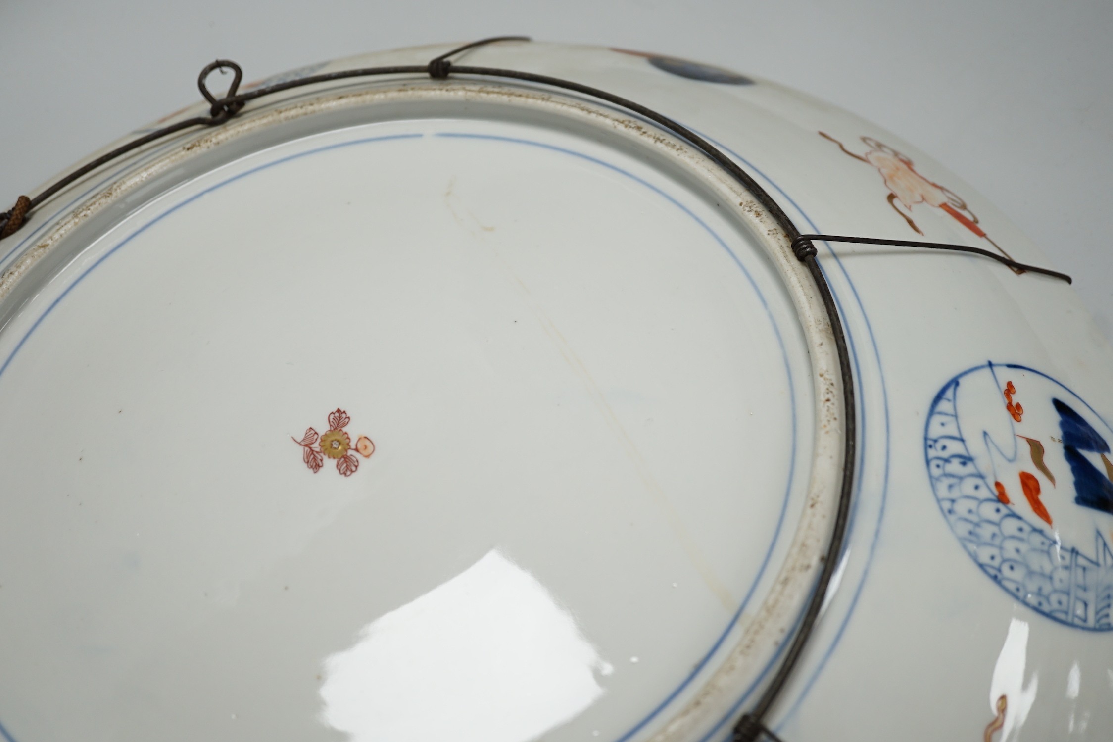 A Japanese Imari ‘dragon and phoenix’ charger, Meiji period, 46cm diameter